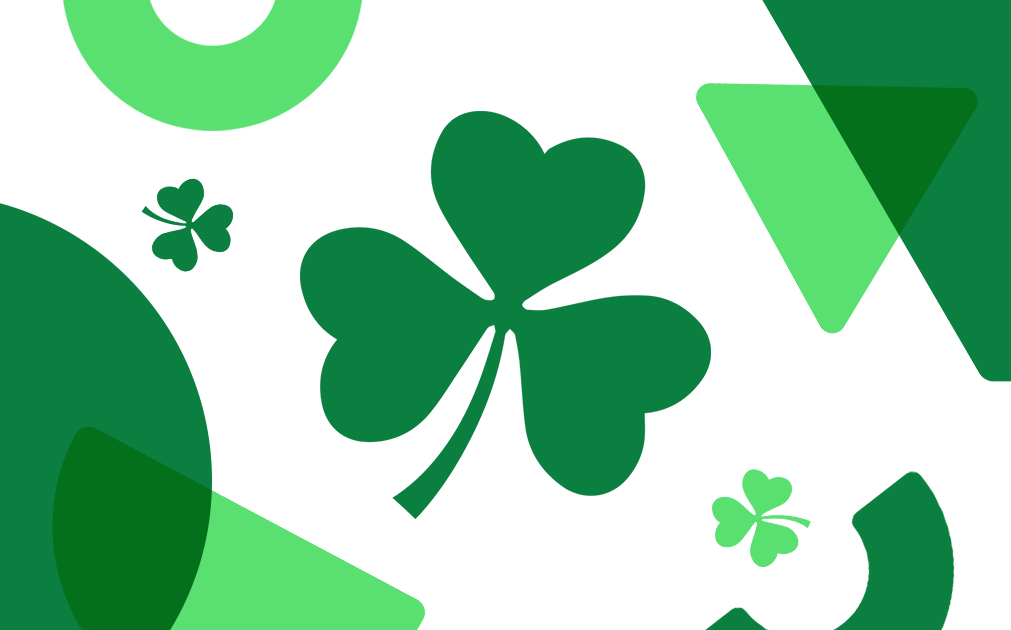An image with a shamrock and some green shapes.
