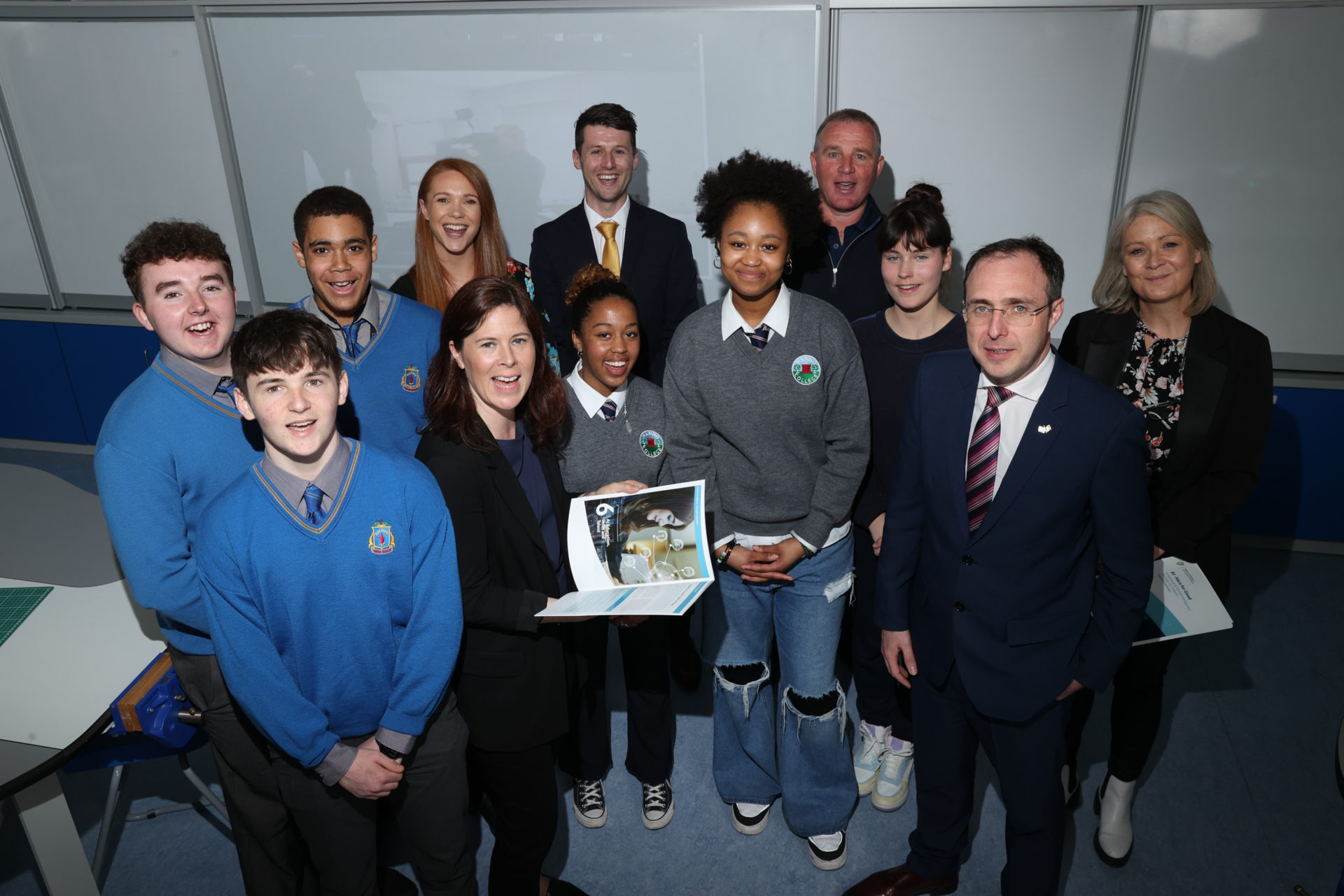 An image of 12 people standing in a classroom, 6 men and 6 women. The women standing in the middle is Dr. Patricia Scanlon, Ireland's first AI Ambassador. 